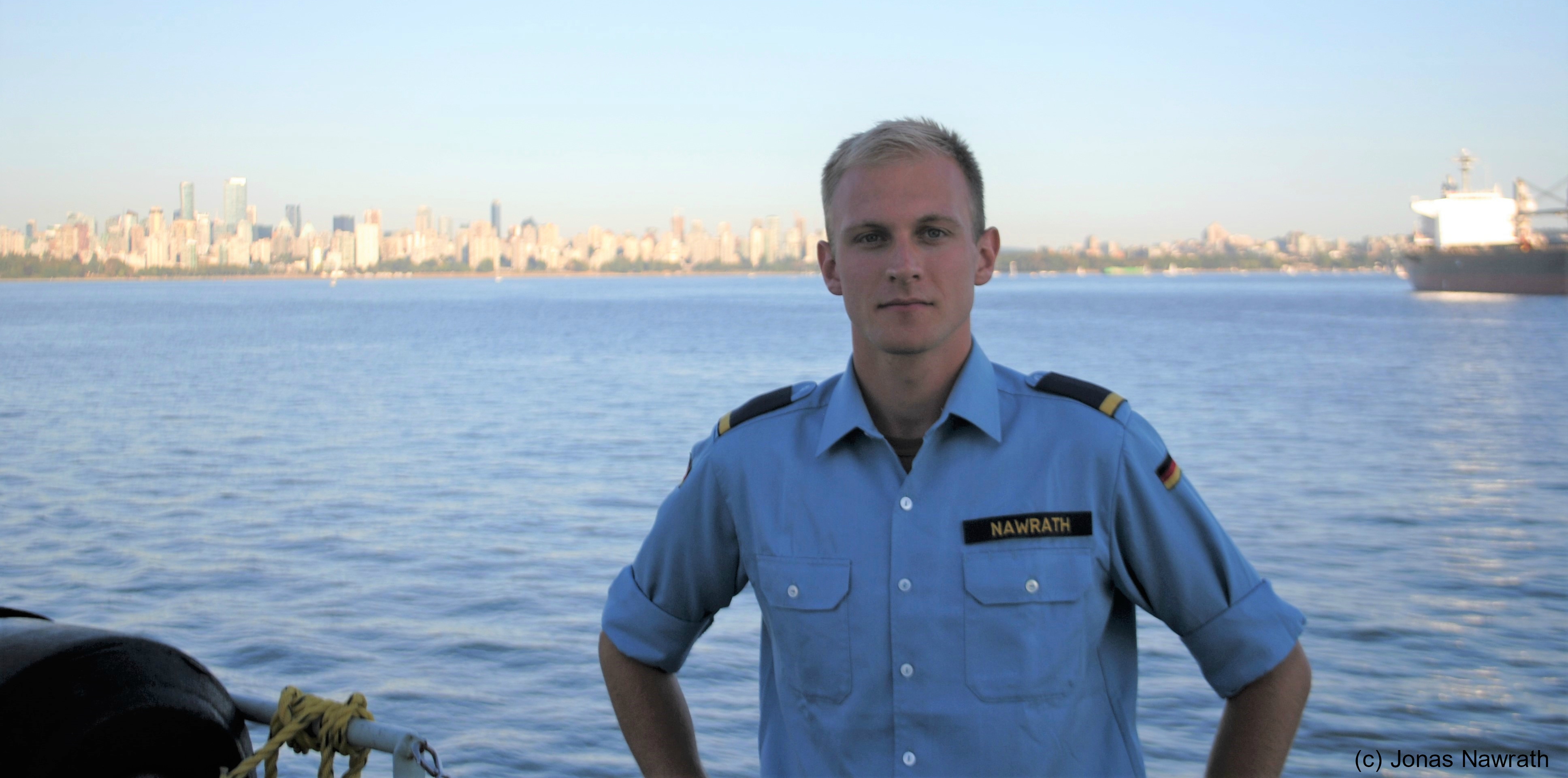 Leutnant zur See Jonas Nawrath in front of Vancouver's skyline